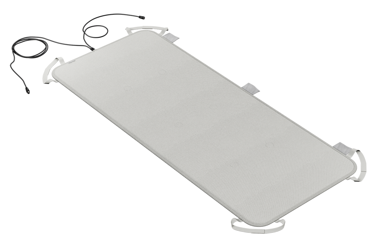 Portable healthcare cot with securing straps and electrical connectors.