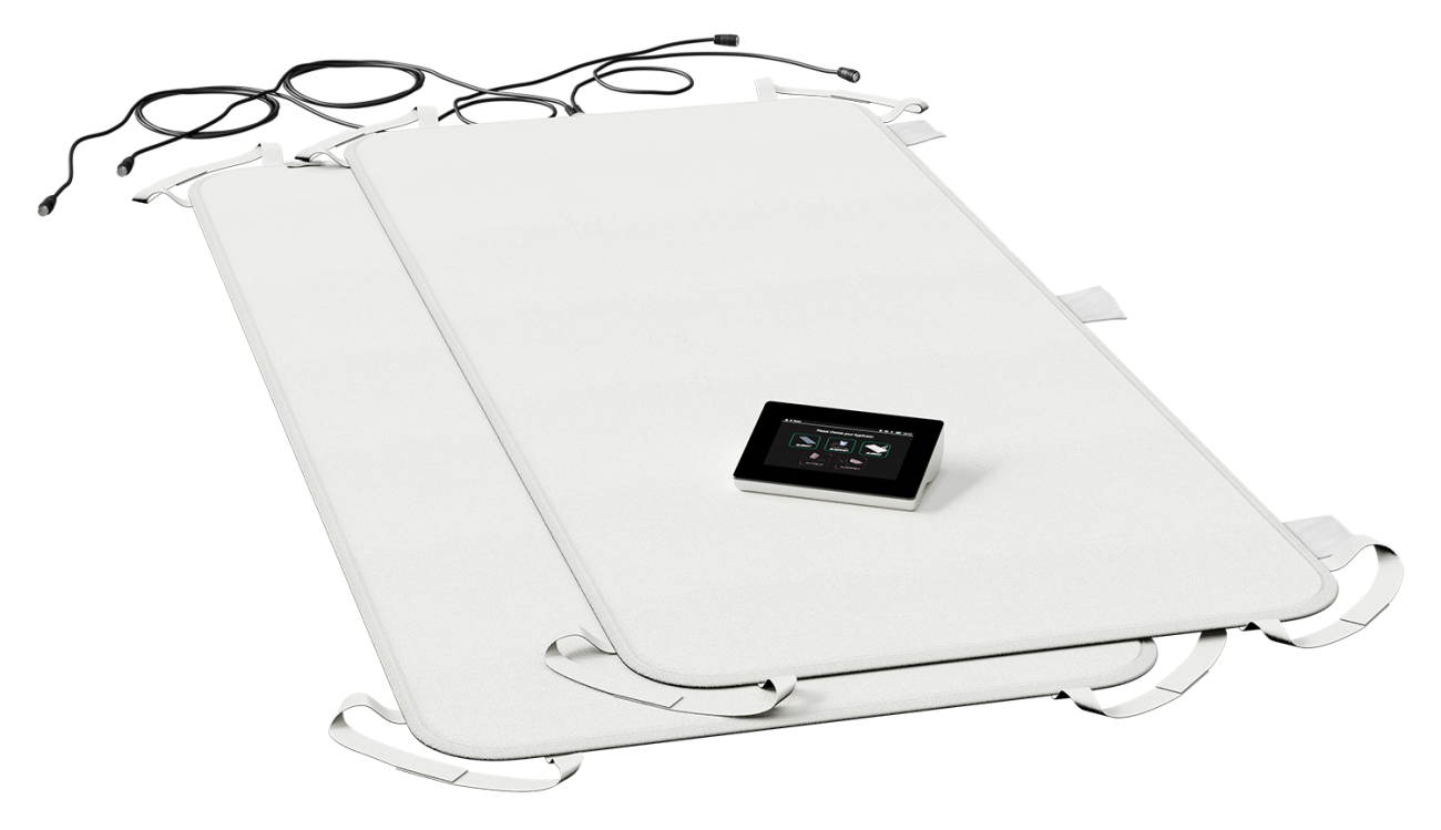 Two white heated mats with a control panel on top.